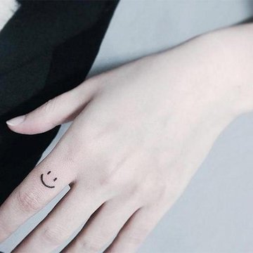 Cute-Smile-Symbol-Tattoo-On-Finger-st405.jpg