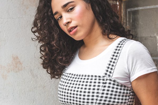 woman-wearing-black-and-white-crop-top-standing-beside-wall-2813353.jpg